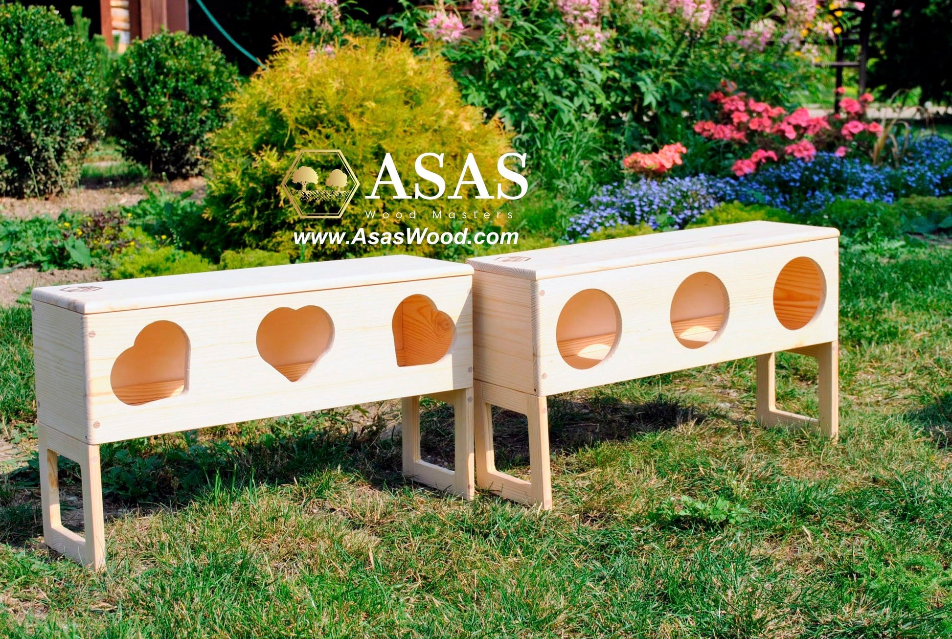 rabbit hay feeders outside on a sunny day surrounded by flowers, made by asaswood