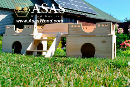 cute bunny rabbit wooden castle on green grass