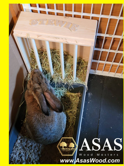 Cute bunny rabbit eating hay from wooden rabbit hay feeder and sitting inside rabbit litter box xl size, hay feeder with personalization, made by AsasWood