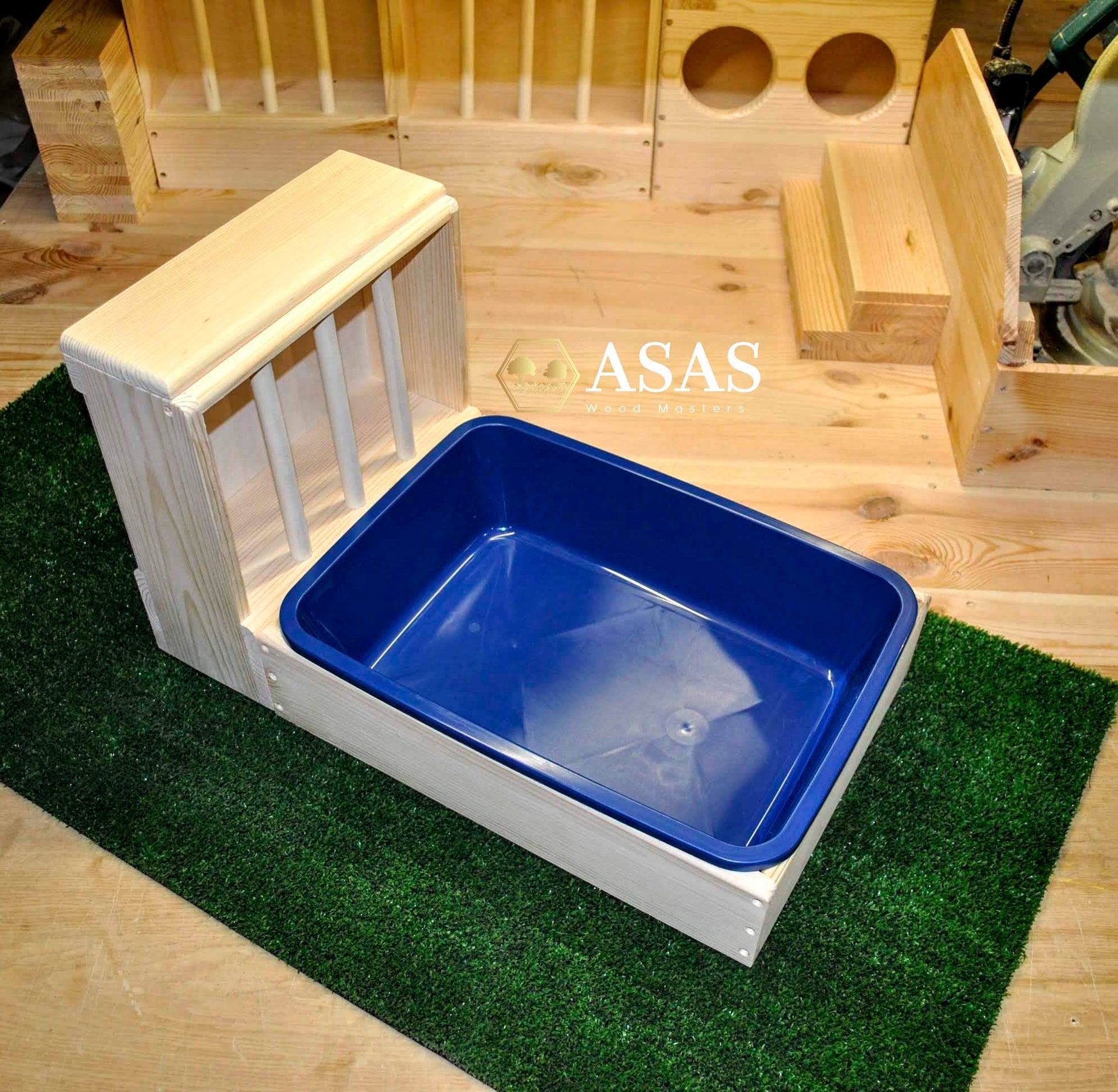 bunny rabbit litter box with blue litter pan and hay feeder with bars wooden