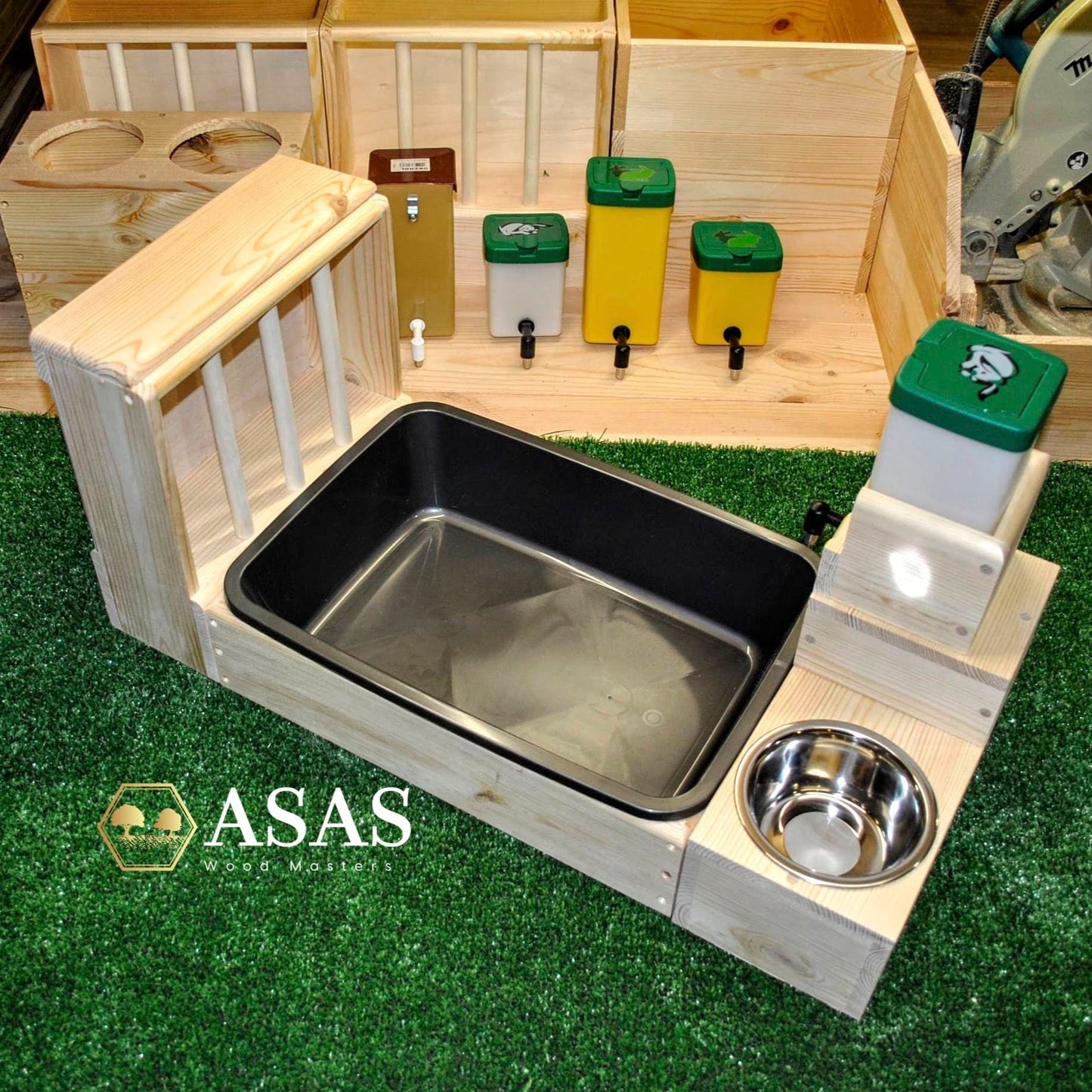 black litter pan with wooden box and hay feeder