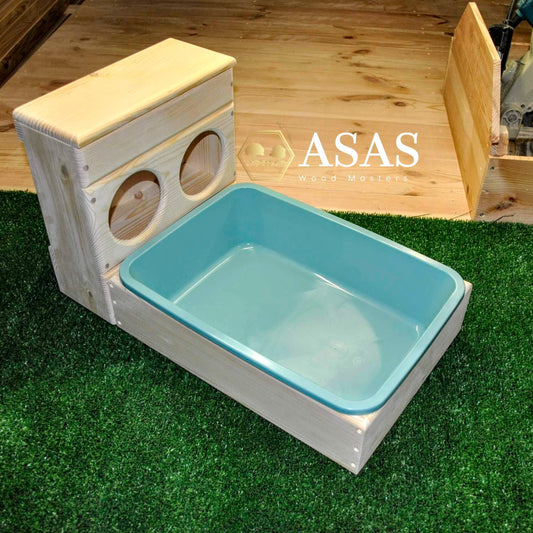 rabbit hay feeder with holes and litter box
