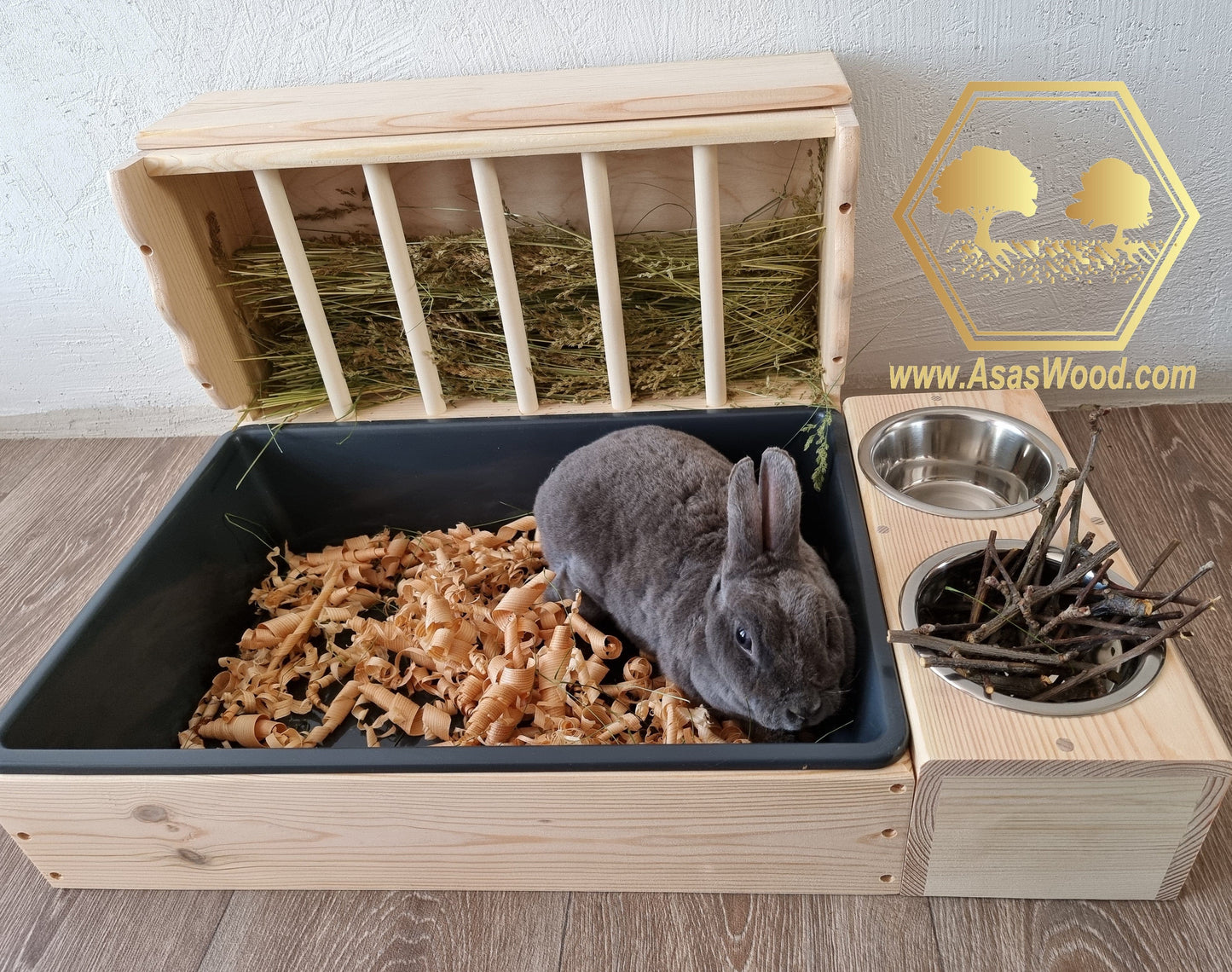 rabbit hay feeder with litter box and food bowls large size with beautiful bunny rabbit lying in the litter box
